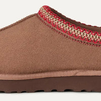 Brown slipper with red and beige trim on a white background