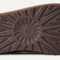 Brown shoe sole with geometric pattern on a white background