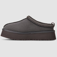 Gray slip-on shoe with a thick sole on a light gray background