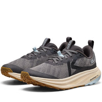 Pair of gray athletic shoes with brown soles on a white background