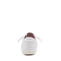 A single white canvas sneaker shown from the back, featuring a textured dark brown leather heel tab and white laces, set against a plain white background.