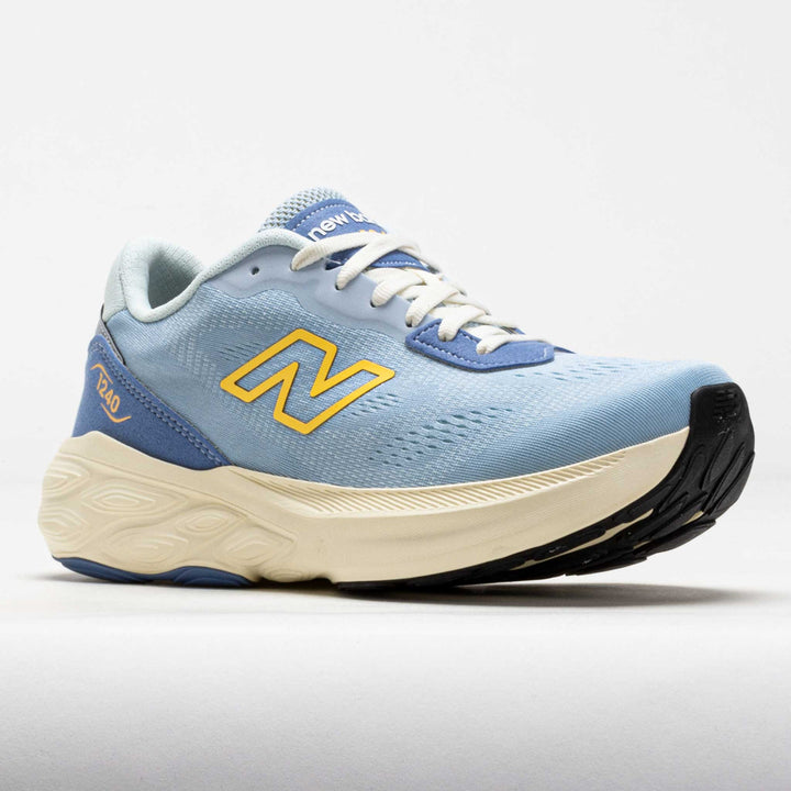 Blue running shoe with yellow logo on a light gray background
