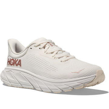 Quarter turn view Women's Hoka Footwear style name Arahi 7 in color Blanc De Blanc/ Rose Gold. Sku: 1147851-BSG