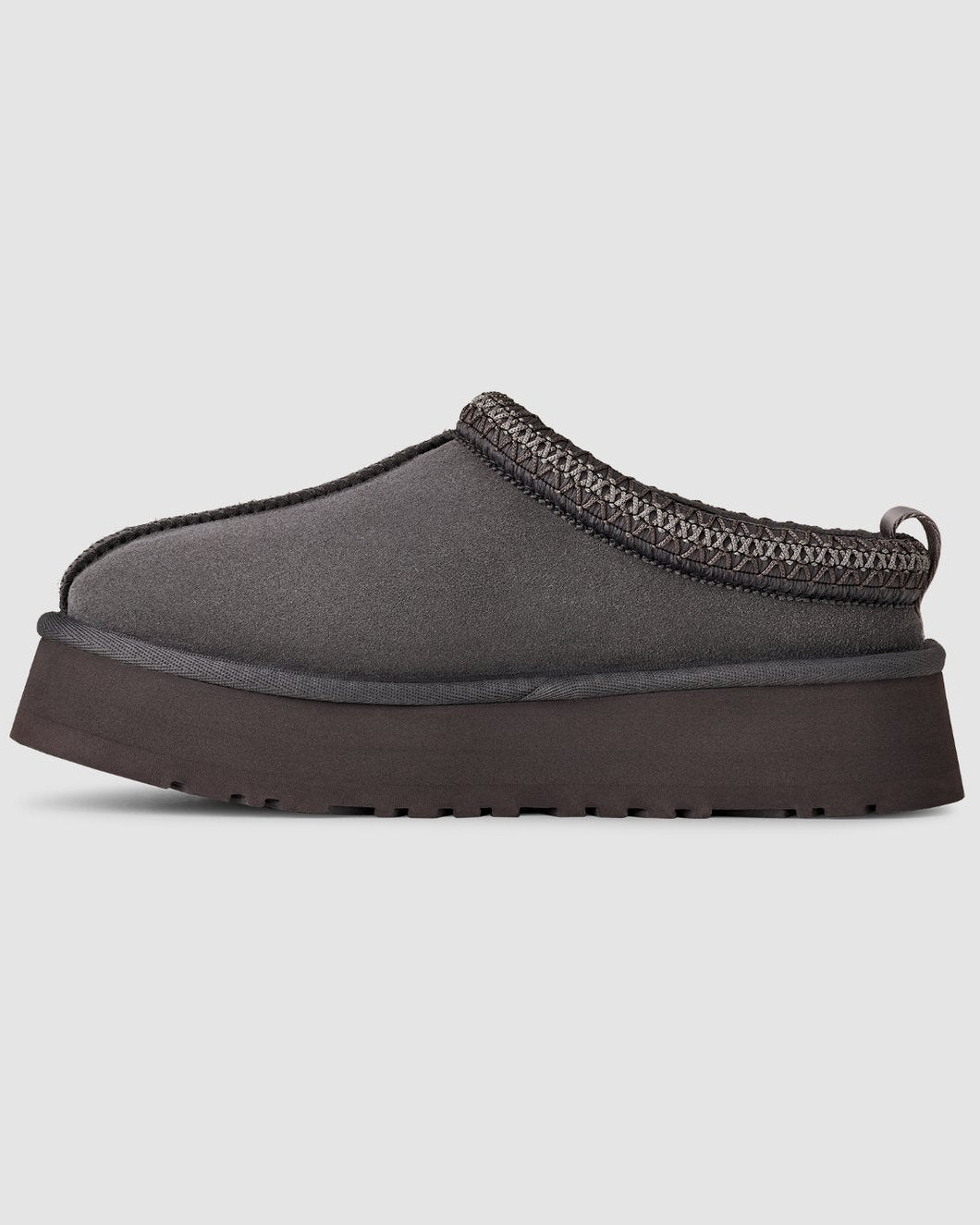 Gray slip-on shoe with a thick sole on a light gray background