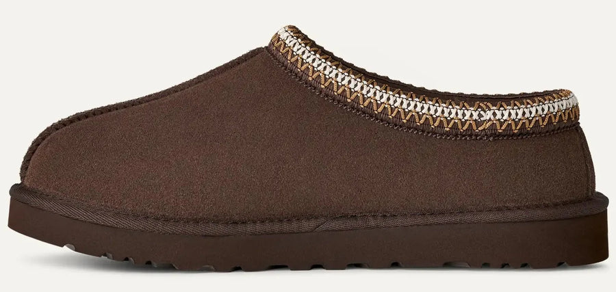 Brown slipper with patterned trim on a white background