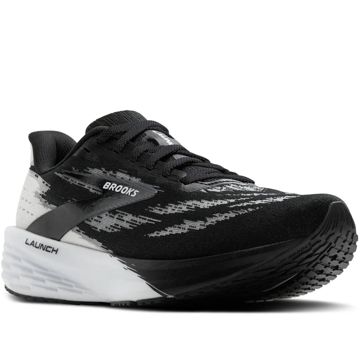 Quarter turn Women's Brooks Footwear style name Launch 11 Wide in color Black/ White. Sku: 120439-1D087