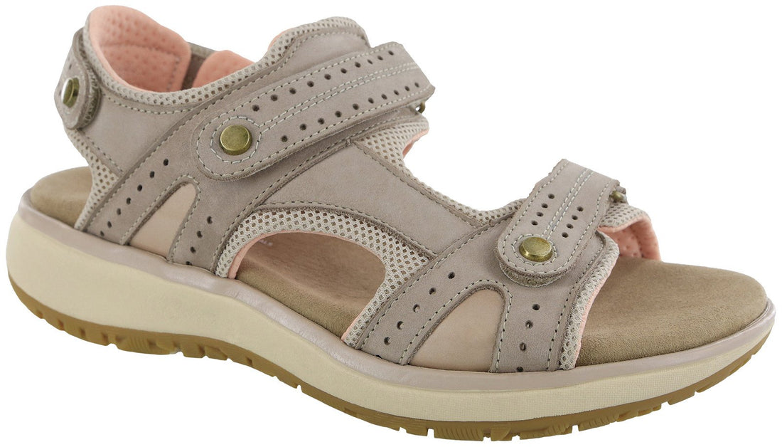 Beige sandal with pink interior on a white background