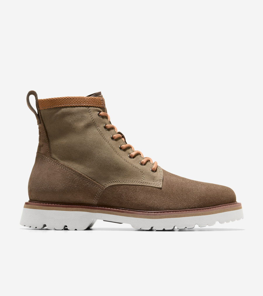 Brown leather boot with white sole on a light gray background