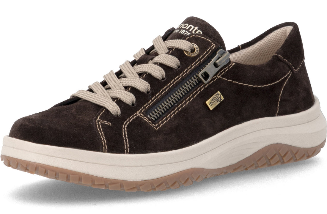 A dark brown suede sneaker with off-white laces, a side zipper, and a thick off-white midsole with a tan outsole, shown on a white background.