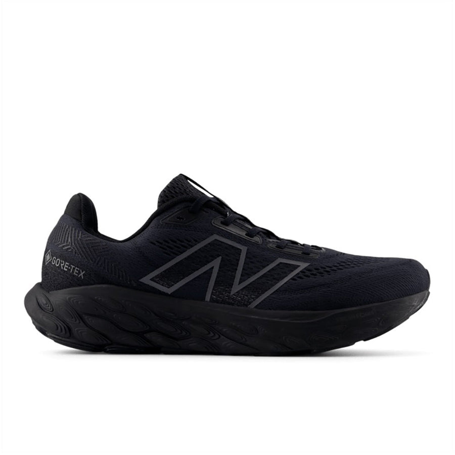 Quarter turn view Men's New Balance Footwear style name 880V14 GTX Wide in color Black/ Phantom/ Magnet. Sku: M880GA14-2E