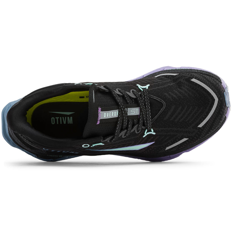 A black Otivm running shoe shown from a side profile view against a solid white background, featuring light blue, purple, and lime green accents.