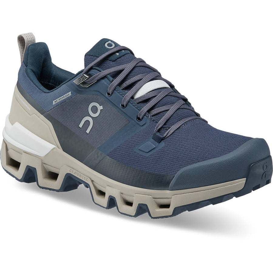 Quarter view Women's On Running Footwear style name Cloudwander Waterproof color Navy/ Desert. Sku: 73-98572